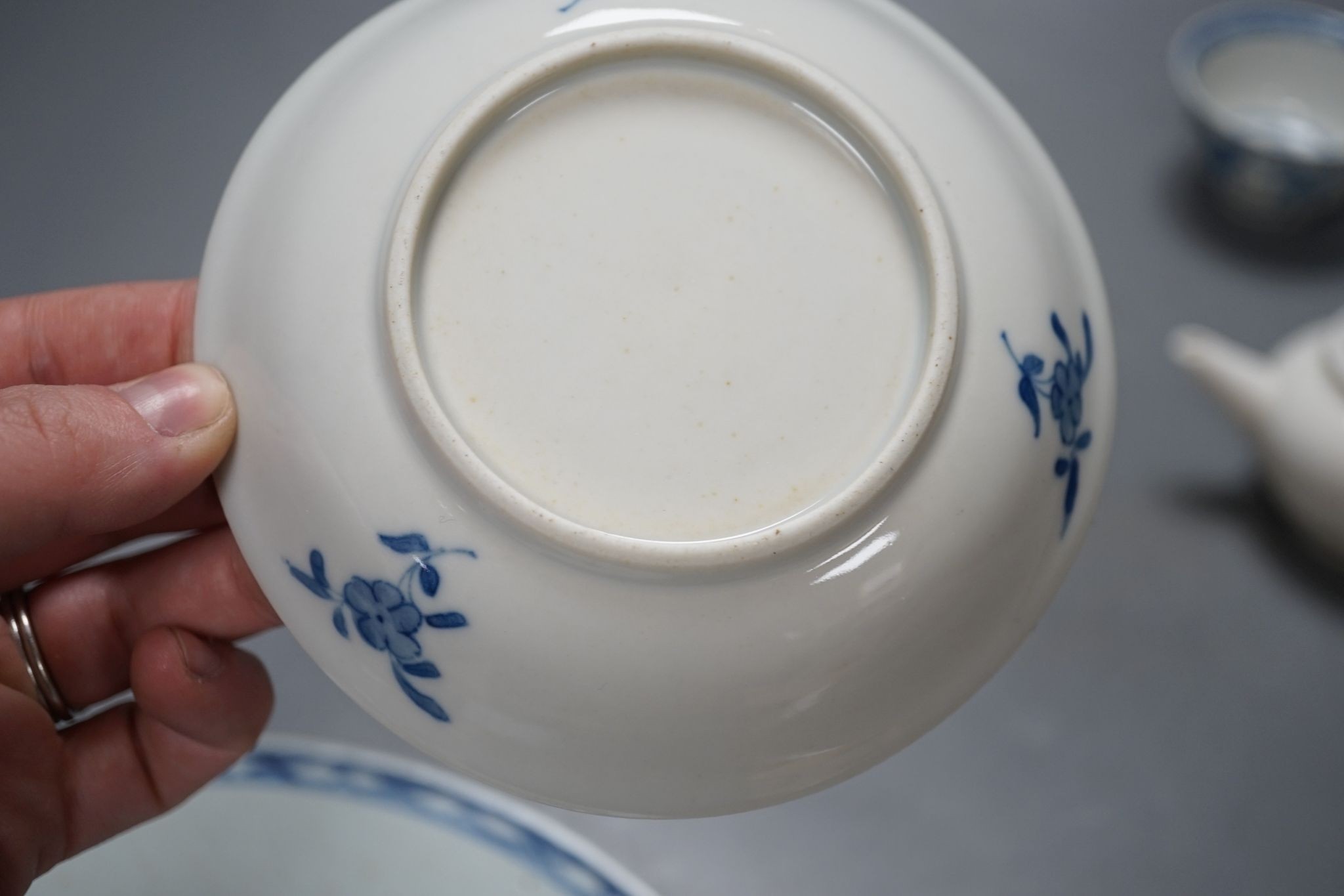 A Chinese blue and white plate, 23.5 cm, a similar tea bowl and saucer, a saucer and a white glaze teapot and cover, 18th century and later